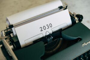 Close-up of a vintage typewriter with the year 2030 typed on paper symbolizing future concepts.