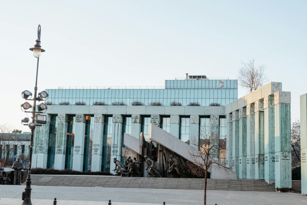 Daytime view of a modern building with classical elements in Warsaw.